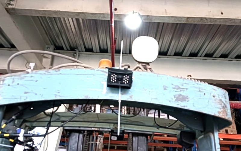 AI camera system mounted on warehouse equipment